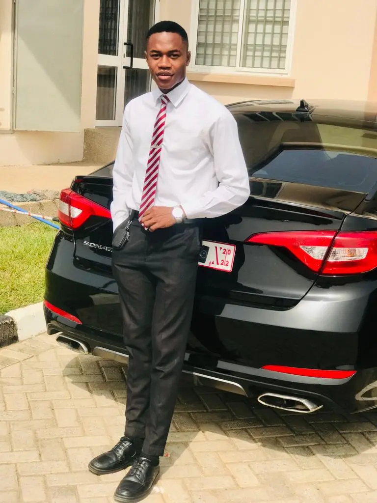 Ezra Taft Brigham Essien smiling in professional casual attire